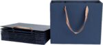 Blue paper gift bags with ribbon handles, standing and folded flat