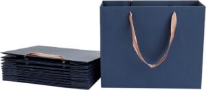 Blue paper gift bags with ribbon handles, standing and folded flat