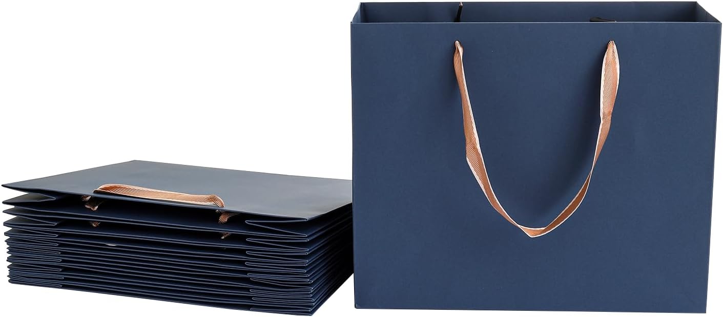 Blue paper gift bags with ribbon handles, standing and folded flat