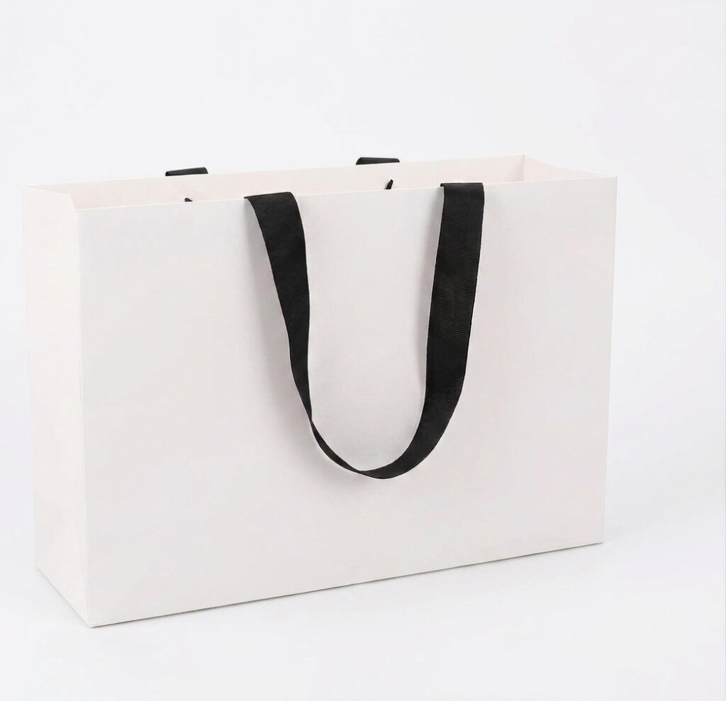 Premium matte gift bags with grosgrain ribbon handles