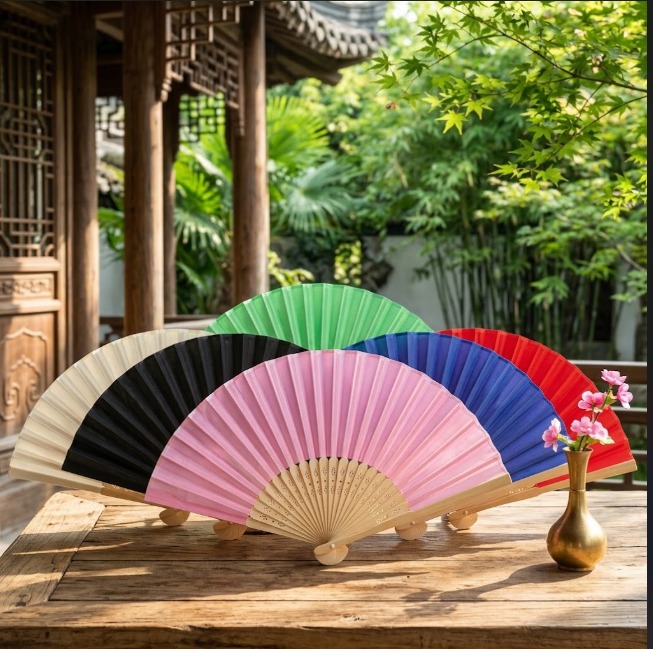 Folding bamboo paper fans in pink, black, green, blue and red