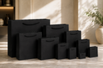 Black textured paper gift bags with handles in assorted sizes