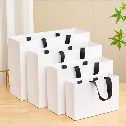 Premium matte gift bags with grosgrain ribbon handles