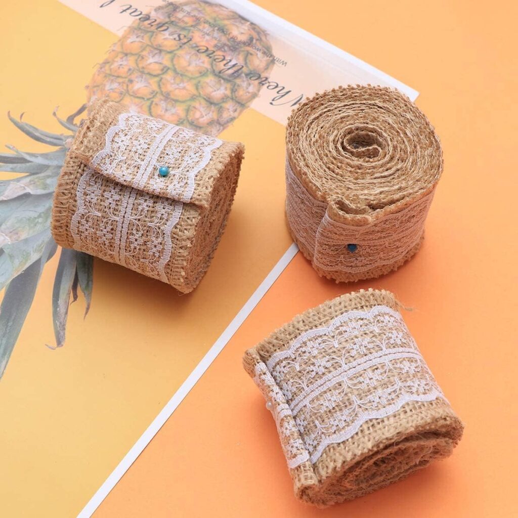 Burlap lace ribbon roll with white lace on natural brown jute