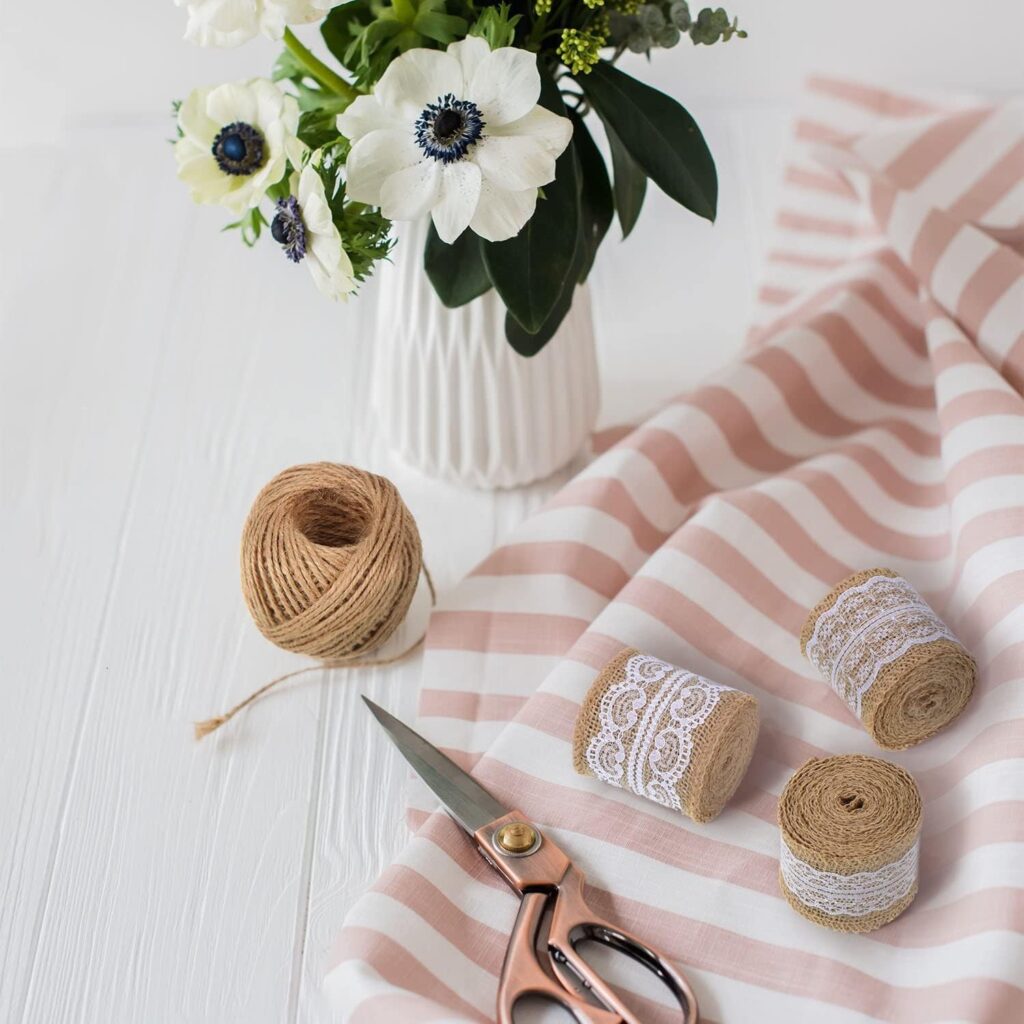 Burlap lace ribbon roll with white lace on natural brown jute