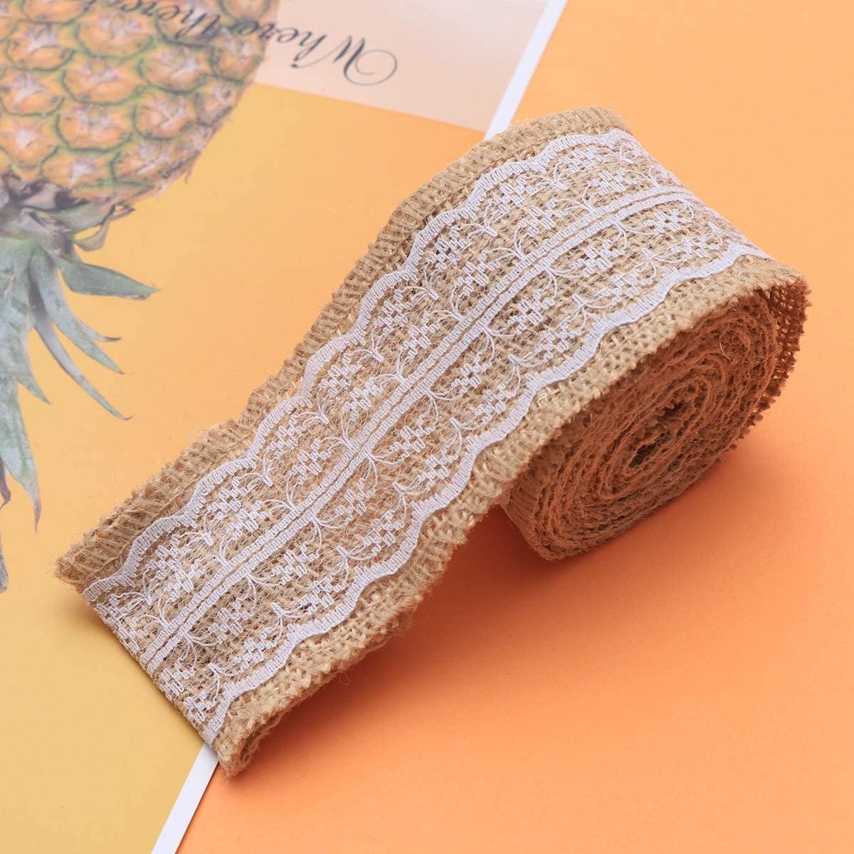 Burlap lace ribbon roll with white lace on natural brown jute